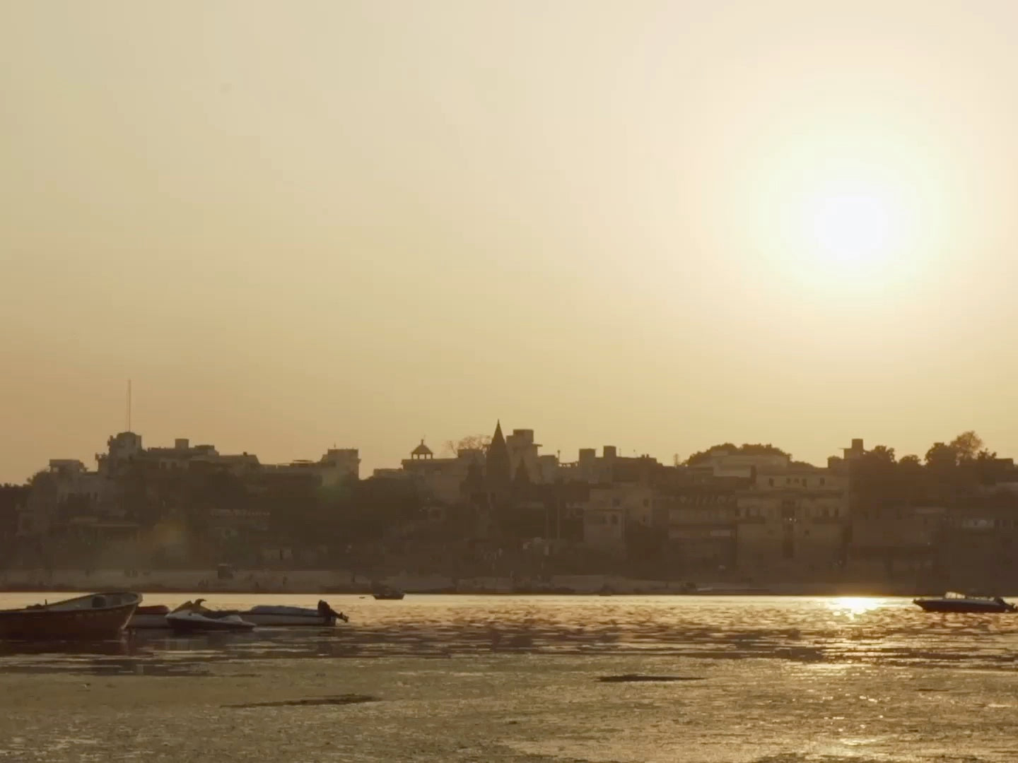 Sunset over a river and an Indian city